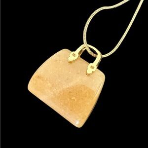 Semi precious purse pendant plus a gold plated necklace